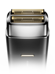 Shaver with gold head on a white background