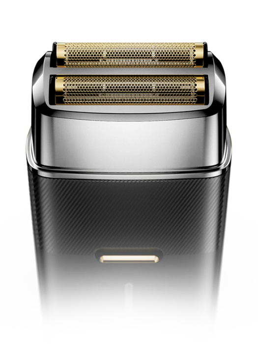 Shaver with gold head on a white background