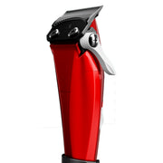 A red ANDIS cordless hair clipper with a black cutting blade, white lever, and a small digital display screen on the front, shown against a solid white background.
