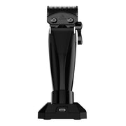 Zephyr black hair clipper, lower housing, and blade on a charging stand on a white background