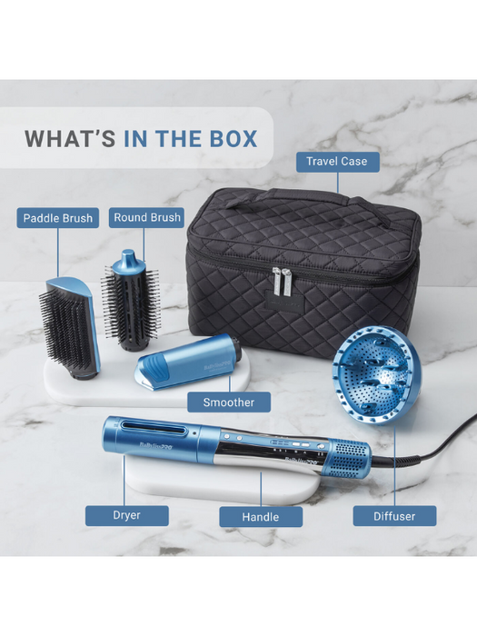 Hair styling tool set with travel case on a marble background