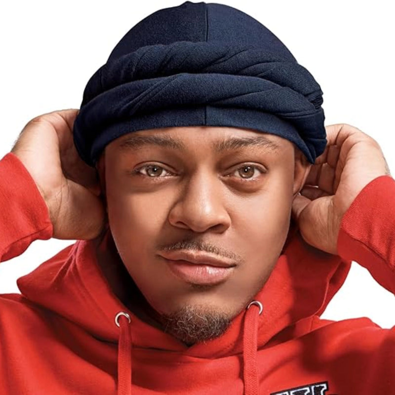 Person wearing a red hoodie and navy hair turban against a white background