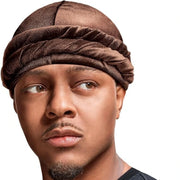 Person wearing a red hoodie and brown hair turban against a white background