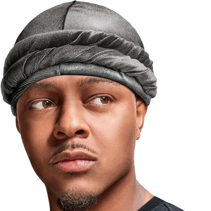 Person wearing a red hoodie and gray hair turban against a white background