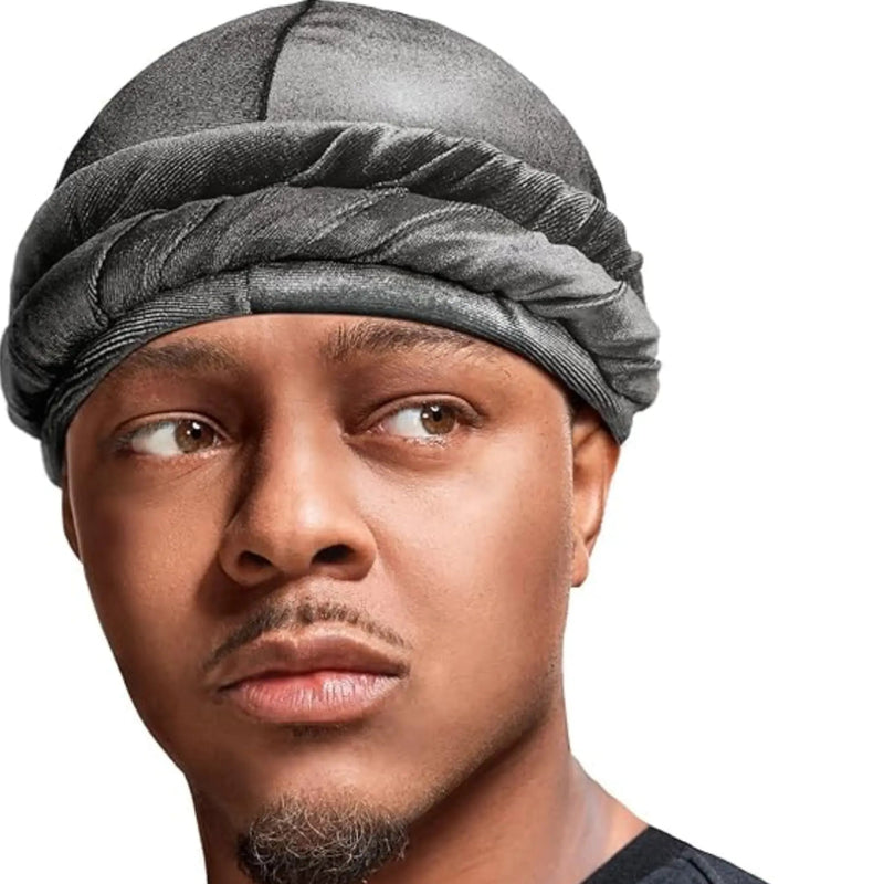 Man wearing a gray head wrap against a white background