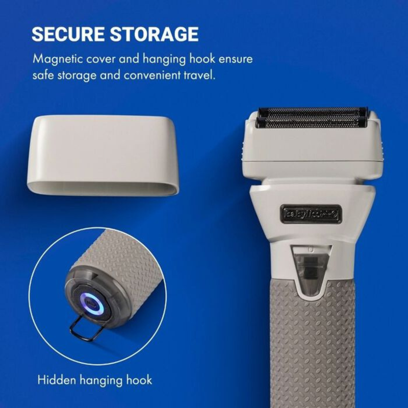 Electric foil shaver standing on ice next to a battery-charging stand holding an FXONE battery, emphasizing all-day power, quick-swap battery, and dual-voltage capability.