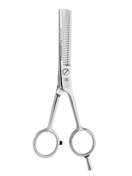 Hair cutting scissors with a comb on a white background
