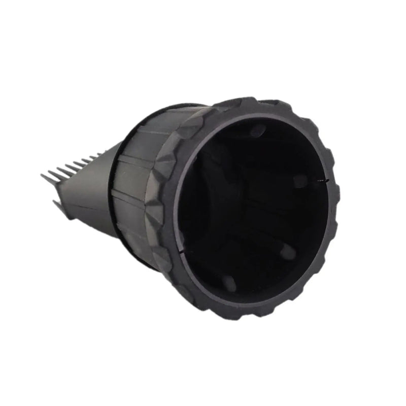 Black plastic fitting with textured surface on a white background