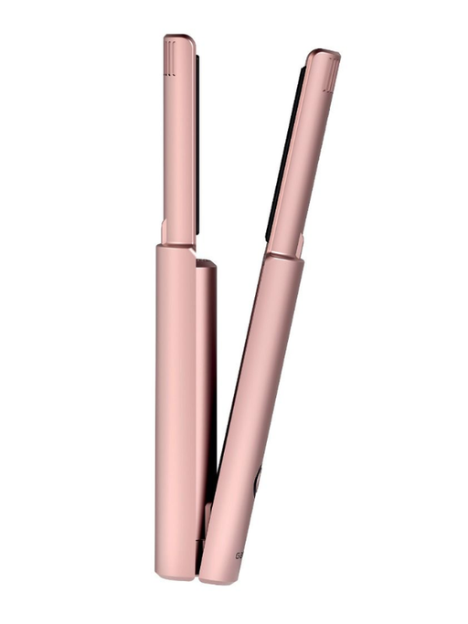 Rose gold hair straightener on a white background