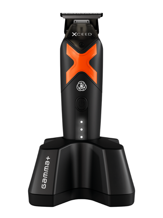 Black and orange grooming tool with 'Xceed' branding on a white background
