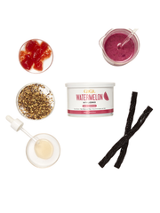 Collection of skincare products including a watermelon-flavored product, black licorice, and a dropper bottle on a white background.