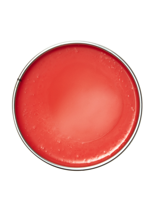 Red lip balm in a round container on a white background