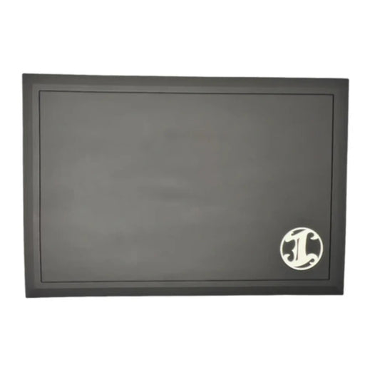 Black barber station mat with a white "I" Logo on a white background