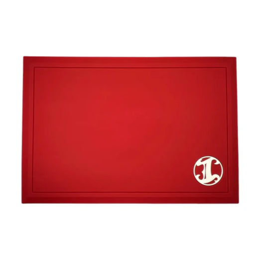 Red barber station mat with a white "I" Logo on a white background