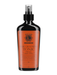 Hair grooming tonic bottle with orange label on a white background