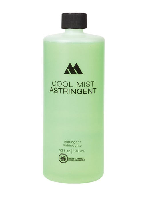 Green bottle of Cool Mist Astringent with black cap on a white background