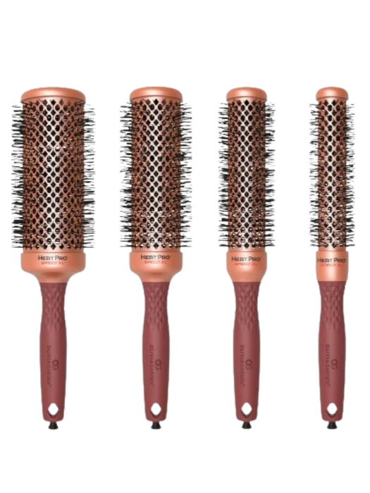 Set of four round hairbrushes with brown handles and metal bristle heads on a white background.