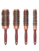 Set of four round hairbrushes with brown handles and metal bristle heads on a white background.