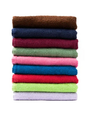 Stack of colorful folded towels on a white background