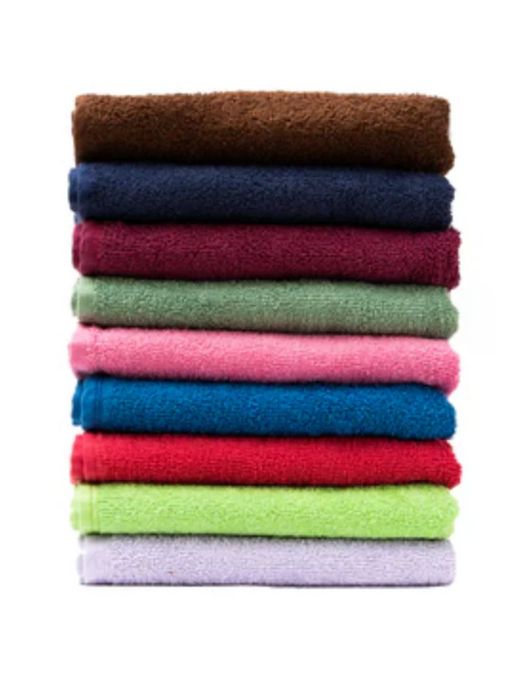 Stack of colorful folded towels on a white background