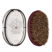 Beard brush with bristles and clear case on a white background