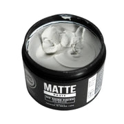 Jar of matte paste with a black lid on a white background