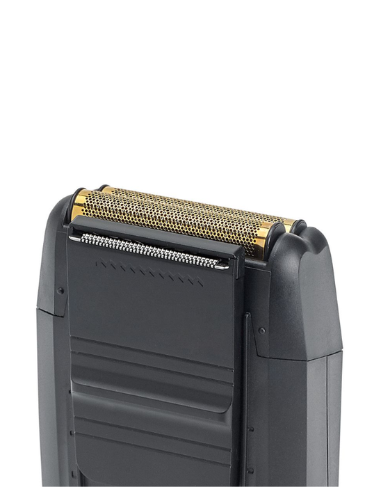 Close-up of a hair dryer with a metallic grille on a white background