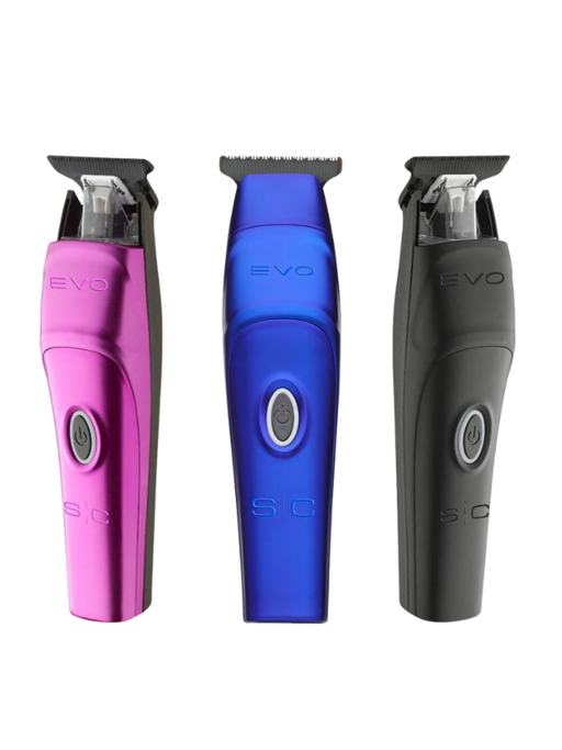 Three electric shavers in pink, blue, and black on a white background