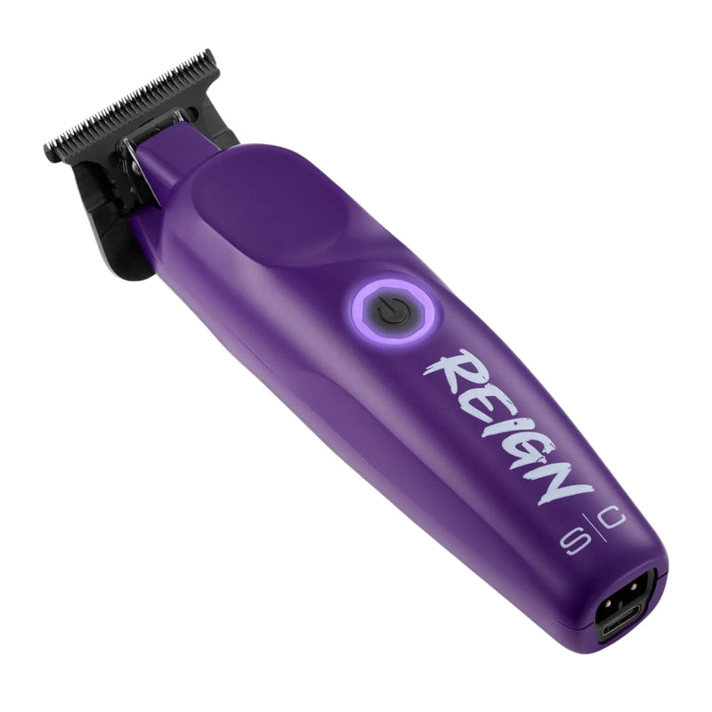 Purple hair trimmer with 'REIGN' branding on a white background
