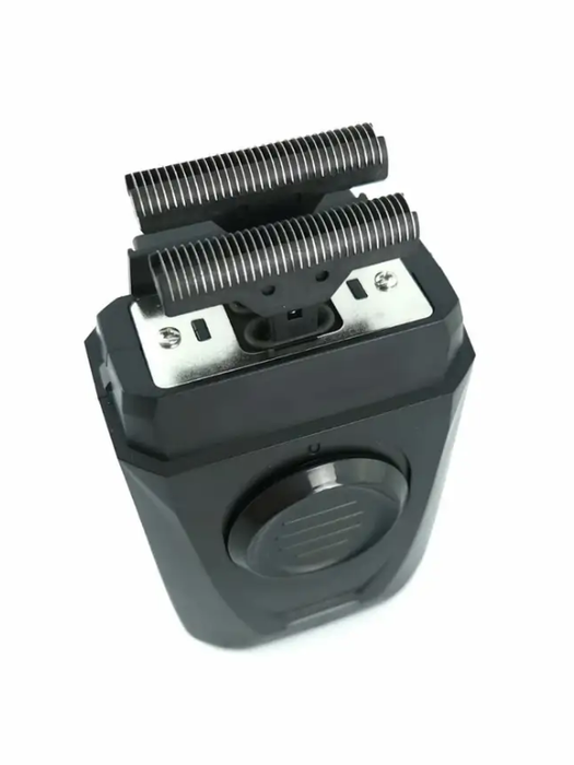 Black electric shaver on a white background