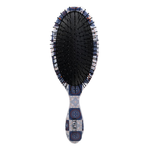 Hairbrush with decorative handle on a white background