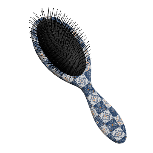 Hairbrush with a patterned handle on a white background