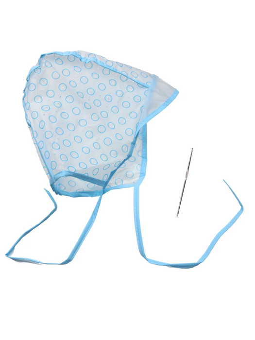 Blue polka dot bonnet with a needle on a white background