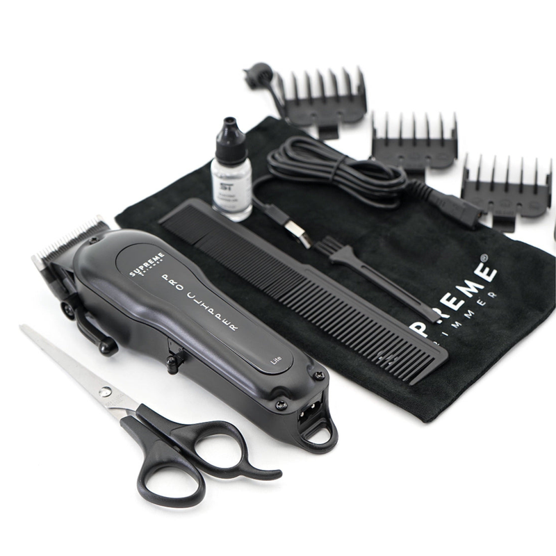Supreme trimmer hair clipper labeled 'Supreme' with accessories on a white background