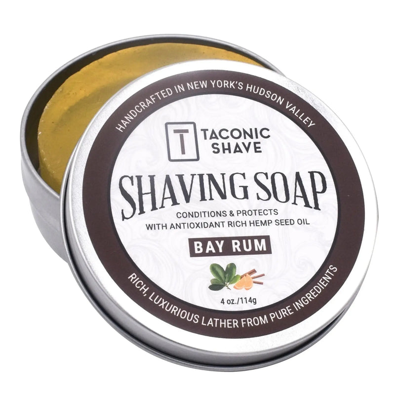 Taconic Shave shaving soap in a metal tin with a white label on a white background