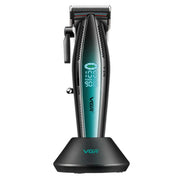 Black and green VGR hair clipper on its charging base on a white background