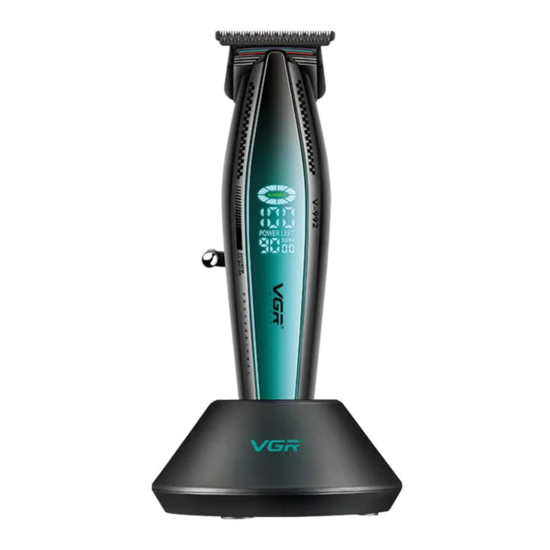 Black and green vgr trimmer on charging base on a white background