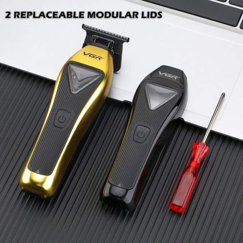 Gold and black VGR grooming tool with replaceable modular lids on a textured surface.
