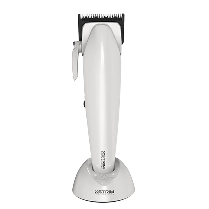 A white XSTrim cordless hair clipper with a black blade attachment, standing upright on its matching white charging base against a plain white background.