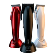 Three cordless hair clippers in red, black, and white, standing upright on matching charging bases against a plain white background. The center black clipper is most prominent, with the red and white clippers flanking it.