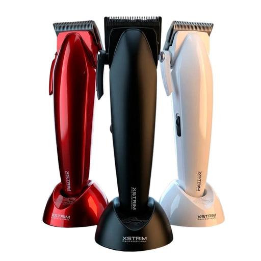 Three cordless hair clippers in red, black, and white, standing upright on matching charging bases against a plain white background. The center black clipper is most prominent, with the red and white clippers flanking it.