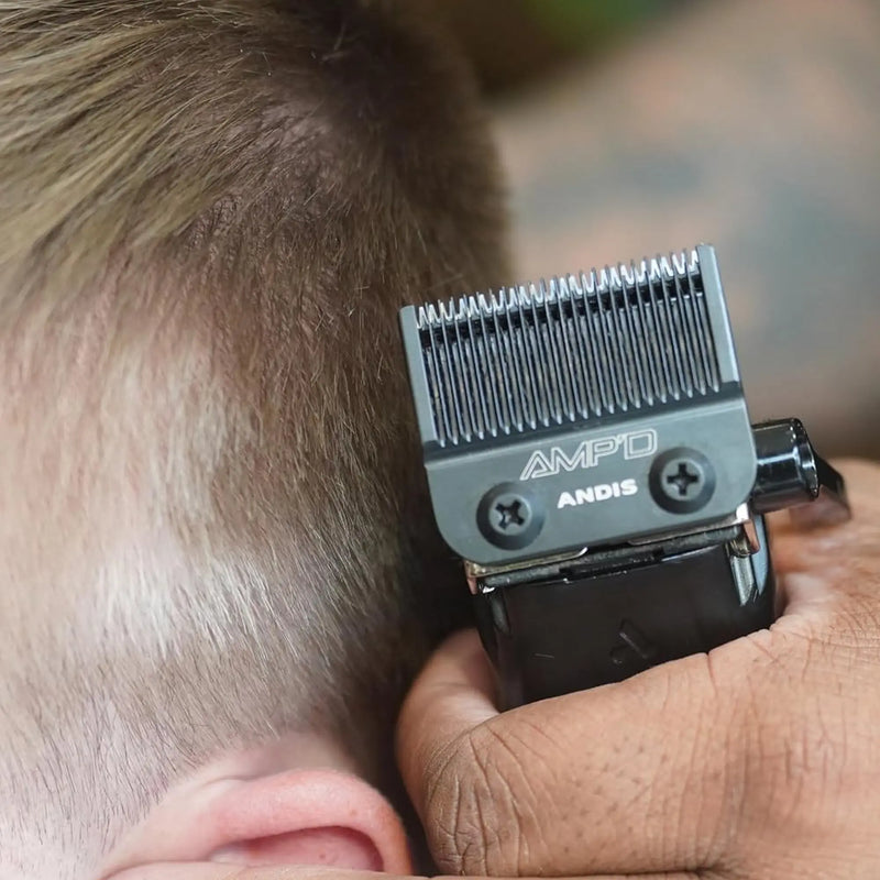 Barber using an Andis AMP'D clipper blade for detailed haircut fading