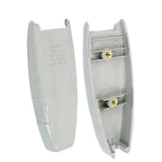 Two light gray plastic electrical components, likely switch or outlet covers, shown on a plain white background. One piece is the outer cover with printed specifications, and the other shows the inner side with two screw terminals and small gold-colored fasteners.
