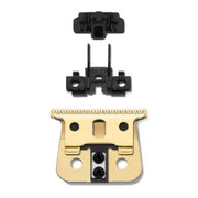 Gold and black grooming clipper blade on a white background