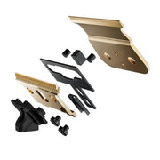 Set of gold and black hair clipper attachments on a white background