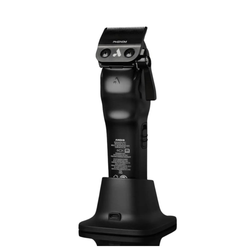 Black Philips Norelco hair clipper standing upright on its charging dock against a plain white background.