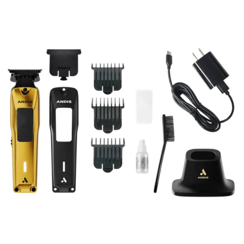 A professional hair trimmer kit by ANDIS, featuring a gold and black trimmer, a black guard comb set, a black charging cable, a black stand, a cleaning brush, and a small cleaning bottle, arranged neatly on a white background.