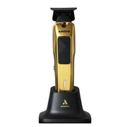 Gold and black ANDIS cordless clipper standing on a black charging base against a white background.