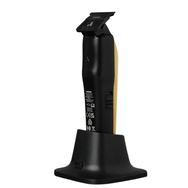 Black cordless electric hair clippers with a gold accent on the handle, shown standing upright on a matching black charging dock against a plain white background.