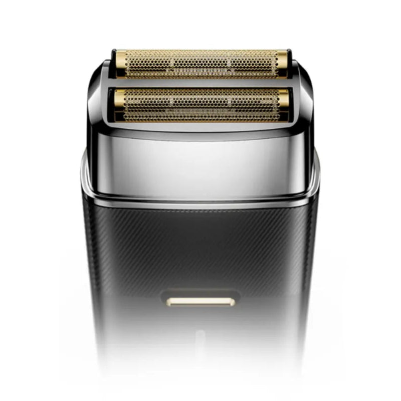 A close-up studio shot of an electric shaver head showing its dual gold-toned rotary blades and polished silver metal collar, set against a clean white background.